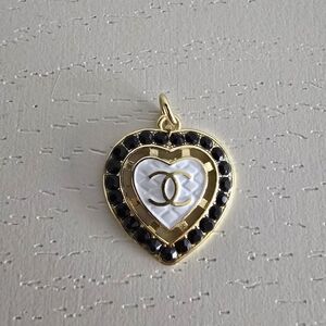 ** SOLD ** CHANEL Gold and Black Heart Pendant